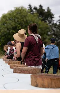 People walking in nature with straw hats
